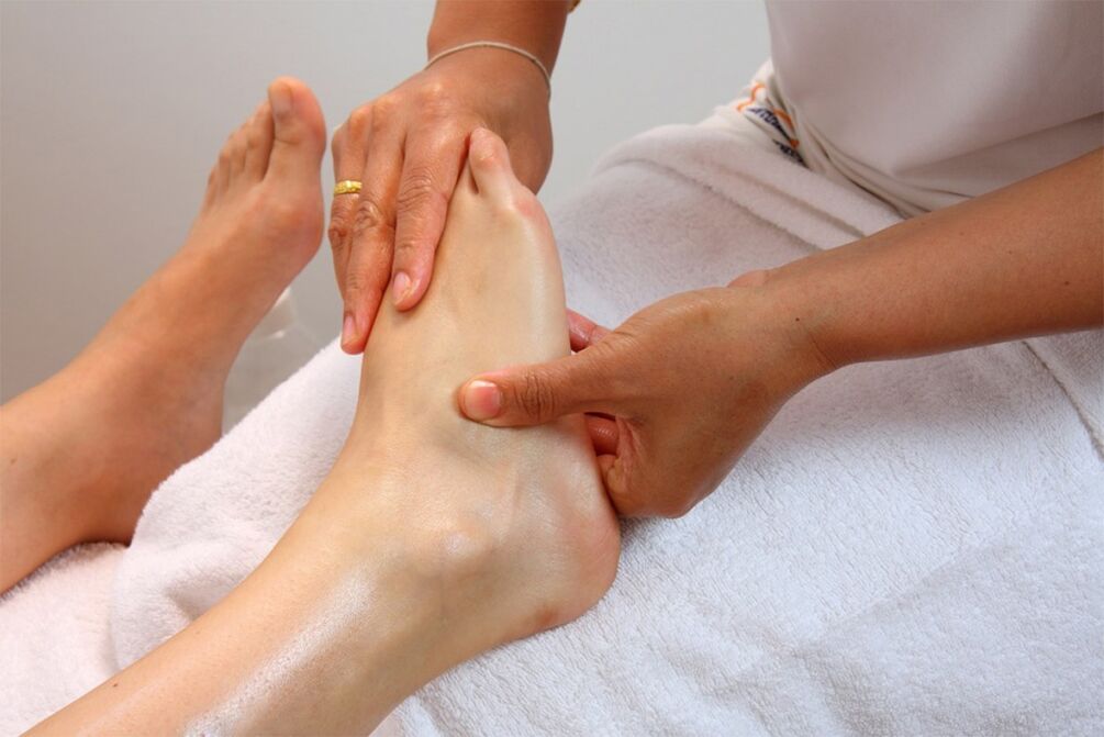 rubbing the foot for arthrosis of the ankle joint